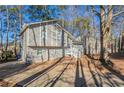 House exterior showcasing gray siding, stone accents and driveway at 3485 Tarragon Dr, Decatur, GA 30034