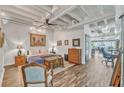 Spacious primary bedroom with hardwood floors and ceiling fan at 805 Peachtree St # 515, Atlanta, GA 30308