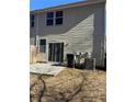 Rear view of the townhome showcasing a sliding glass door and patio at 101 Ellis Dr # 101, Conyers, GA 30012