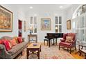 Living room with piano, comfy seating, and large windows at 4470 Crestwicke Pointe, Atlanta, GA 30319