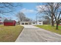 White ranch home with covered carport and expansive yard at 148 Walker Nw Rd, Cartersville, GA 30121