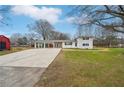 Ranch style home with attached carport and spacious yard at 148 Walker Nw Rd, Cartersville, GA 30121
