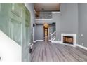 Spacious living room with high ceilings, fireplace, and hardwood floors at 6269 Colonial Vw, Fairburn, GA 30213