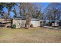 House exterior with mature trees and a yard at 2182 Loring Ct, Decatur, GA 30032