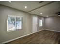Bright and airy living room featuring hardwood floors and neutral walls at 93 Sterling Ridge Dr, Jonesboro, GA 30238