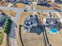 An aerial view showcasing a house with a pool in the neighborhood at 3356 Renfro St, Marietta, GA 30066