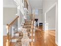 Elegant wooden staircase with wrought-iron railings at 3356 Renfro St, Marietta, GA 30066