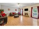 Cozy living room with a fireplace, comfortable seating, and access to a balcony at 4450 Millenium View Ct, Snellville, GA 30039
