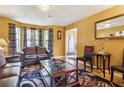 Bright living room with leather furniture and a large window at 4450 Millenium View Ct, Snellville, GA 30039