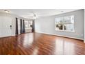 Living room featuring hardwood floors and ample natural light at 5480 Sable Bay Pt, Atlanta, GA 30349