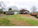 Back of house, deck, and covered patio at 1400 New Hope Church Rd, Loganville, GA 30052