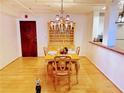 Elegant dining room featuring hardwood floors and a beautiful chandelier at 32 Peachtree Nw St # 1704, Atlanta, GA 30303