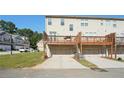 Private backyard with two-car garage and expansive deck at 5534 Radford Loop, Fairburn, GA 30213