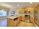 L-shaped kitchen with granite countertops and stainless steel appliances at 103 Linton Dr # 1, Acworth, GA 30102