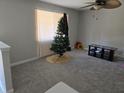 Spacious living room with gray carpet and large window at 2922 Eleanor Ter, Atlanta, GA 30318