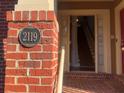 Bronze house number plaque on a brick pillar at 2119 Gorman Se Grv # 126, Atlanta, GA 30316