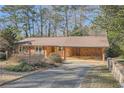 Brick ranch house with carport and landscaping at 2328 Melinda Ne Dr, Atlanta, GA 30345