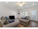 Spacious living room with hardwood floors, two sofas, and a TV at 1756 Evenstad Way, Smyrna, GA 30080