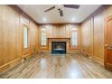 Spacious home office with wood walls and a fireplace at 5490 Powers Overlook Ct, Atlanta, GA 30327