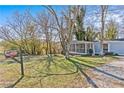 Gray mobile home with a screened porch at 3935 Loganville Hwy, Loganville, GA 30052