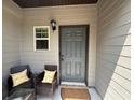 Inviting front porch with wicker chairs, perfect for relaxing at 4193 Shoals Ln, Union City, GA 30291