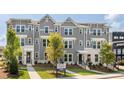Townhomes with gray siding, white trim, and landscaping at 121 Silvia Ln # 22, Hapeville, GA 30354