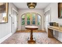Elegant entryway with herringbone floors and arched doors at 2188 Niles Pl, Atlanta, GA 30324