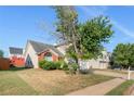 Brick and siding home with a two-car garage and lush green lawn at 80 Keyton Dr, Covington, GA 30016