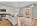 Modern kitchen with stainless steel appliances and hardwood floors at 935 Piedmont Ave # 201, Atlanta, GA 30309