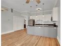 Modern kitchen with island, stainless steel appliances, and hardwood floors at 935 Piedmont Ave # 201, Atlanta, GA 30309