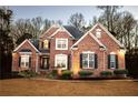 Brick home with manicured lawn and welcoming entryway at 340 Huiet Dr, Mcdonough, GA 30252