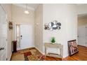 Bright entryway with hardwood floors and decorative accents at 2183 Hampton Se Trl, Conyers, GA 30013