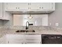 Modern kitchen features granite countertops and stainless steel appliances at 6622 Wellington Sq, Norcross, GA 30093