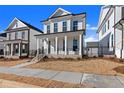 Two-story home with white siding, brick accents, and a front porch at 124 Stonehouse Dr, Cumming, GA 30040
