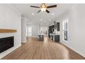 Open concept kitchen with dark cabinetry, island, and stainless steel appliances at 124 Stonehouse Dr, Cumming, GA 30040
