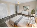 Serene main bedroom with neutral tones and carpet on top of hardwood floor at 2082 Rainbow Dr, Snellville, GA 30039