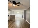 Open living room and dining area with gray walls and wood-look flooring at 16103 Waldrop Cv, Decatur, GA 30034