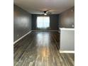 Spacious living room with gray walls and wood-look flooring at 16103 Waldrop Cv, Decatur, GA 30034