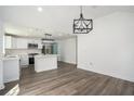 Modern kitchen with white cabinets, island, and stainless steel appliances at 1685 Harbin Sw Rd, Atlanta, GA 30311