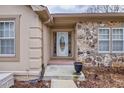 Inviting front entrance with stone accents and landscaping at 2129 Lakeland Ct, Dacula, GA 30019