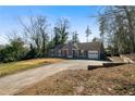 House with a driveway and landscaping at 113 Hillmont Dr, Woodstock, GA 30188