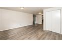 Living room with gray vinyl flooring and neutral walls at 1203 Sandune Dr, Norcross, GA 30093