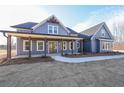 Charming exterior view of a two-story home featuring a welcoming front porch and freshly installed yard at 1330 Temple Draketown Rd, Temple, GA 30179