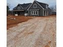 Gray farmhouse with attached garage, gravel driveway at 1330 Temple Draketown Rd, Temple, GA 30179