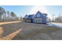 Angle view of home featuring a welcoming front porch and freshly installed yard at 1330 Temple Draketown Rd, Temple, GA 30179