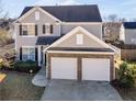 Two-story house with a driveway and a backyard at 11602 Kades Trl, Hampton, GA 30228