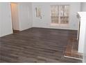 Spacious living room featuring hardwood floors and a fireplace at 1853 Edington Sw Rd, Marietta, GA 30064