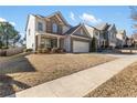 Two-story house with a gray and brick facade, and a large backyard at 686 Westmoreland Ln, Lawrenceville, GA 30043