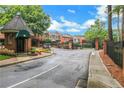 Gated community entrance with guard house at 24214 Plantation Ne Dr, Atlanta, GA 30324