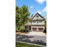 Two-story house with gray siding, brown accents, and a three-car garage at 2741 Prado Ln, Marietta, GA 30066